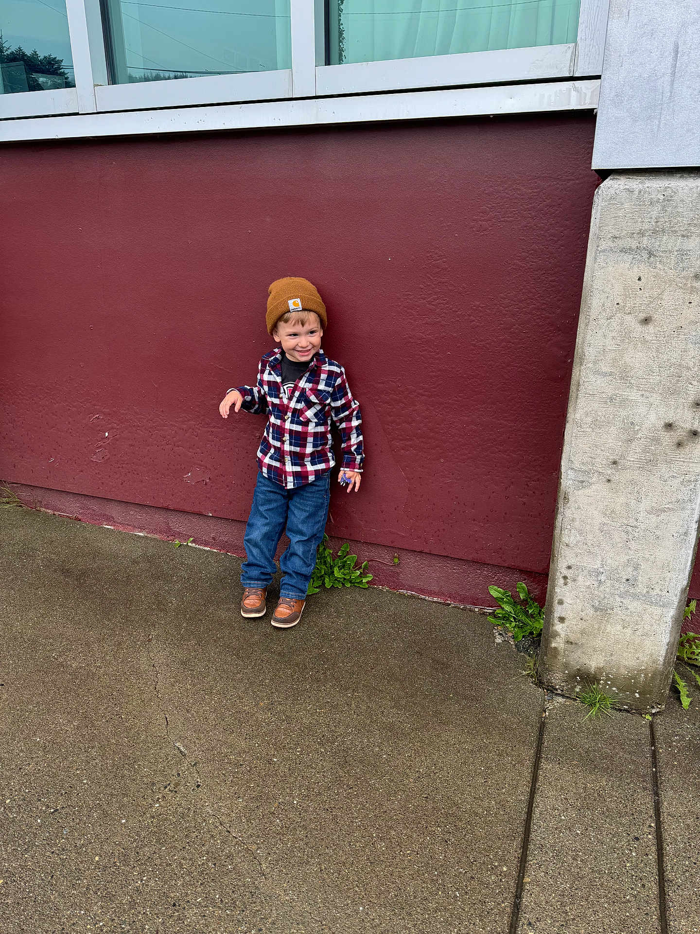 Malakai is registered to the contest to win money with this photo: architecture, boy, building, cap, child, clothing, coat, face, footwear, hat, head, jeans, male, pants, person, photography, portrait, shoe, standing, toy
