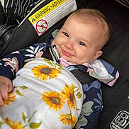 Zoey is registered to the contest to win money with this photo: baby, blanket, car, clothing, coat, cushion, dress, face, happy, head, homedecor, jacket, newborn, person, photography, portrait, smile, t_shirt, transportation, vehicle