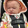 baby, blanket, bonnet, car, clothing, coat, face, gun, hat, head, hood, jacket, newborn, person, photography, portrait, sleeping, transportation, vehicle, weapon