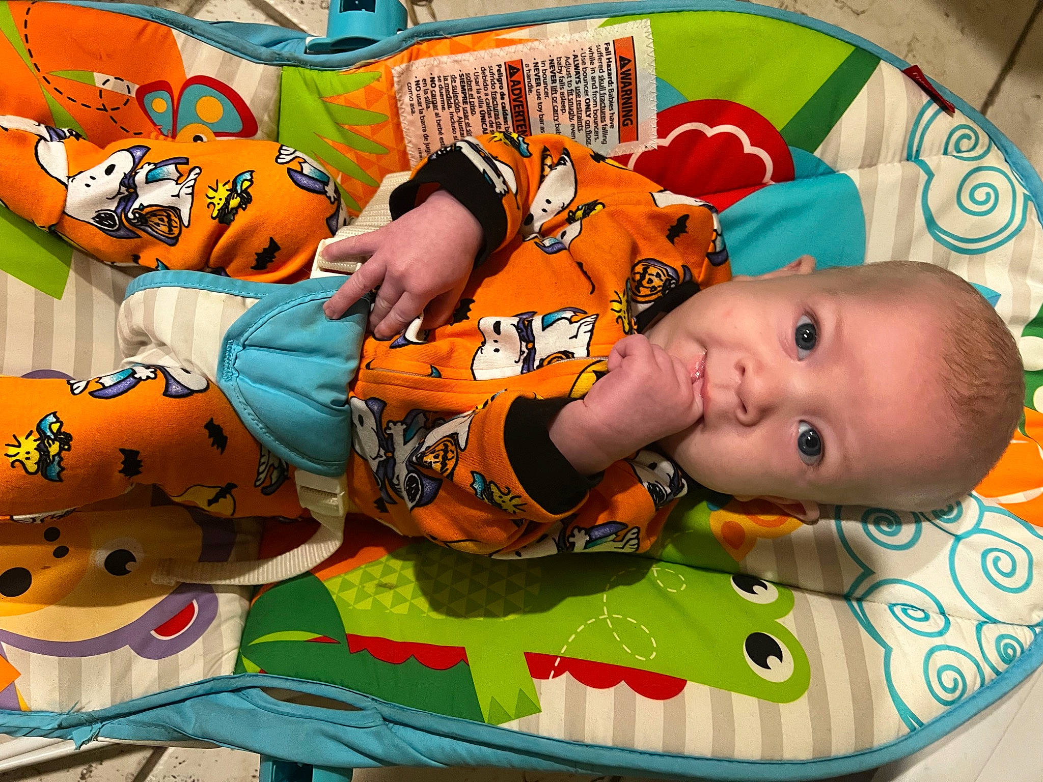 Tyran is registered to the contest to win money with this photo: art, baby, baby_products, baby_toddler_clothing, baby_toys, child, facial_expression, fun, happy, leisure, linens, orange, pattern, person, play, playmat, room, snapshot, textile, toddler