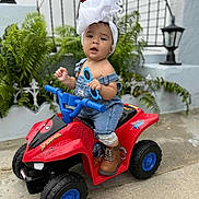 Alendy joined the competition — help win amazing prizes! toddler, child, toy, quad_bike, spiderman, outdoor, plants, headwrap, denim, overalls, sunglasses, boots, concrete, lantern, wall, greenery, face, person, play, cute