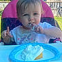 Arya joined the competition — help win amazing prizes! toddler, child, highchair, outdoor, food, cake, whipped_cream, messy, blue_eyes, unicorn, shirt, summer, sunlight, baby, finger, plate, celebration, happy, backyard, person