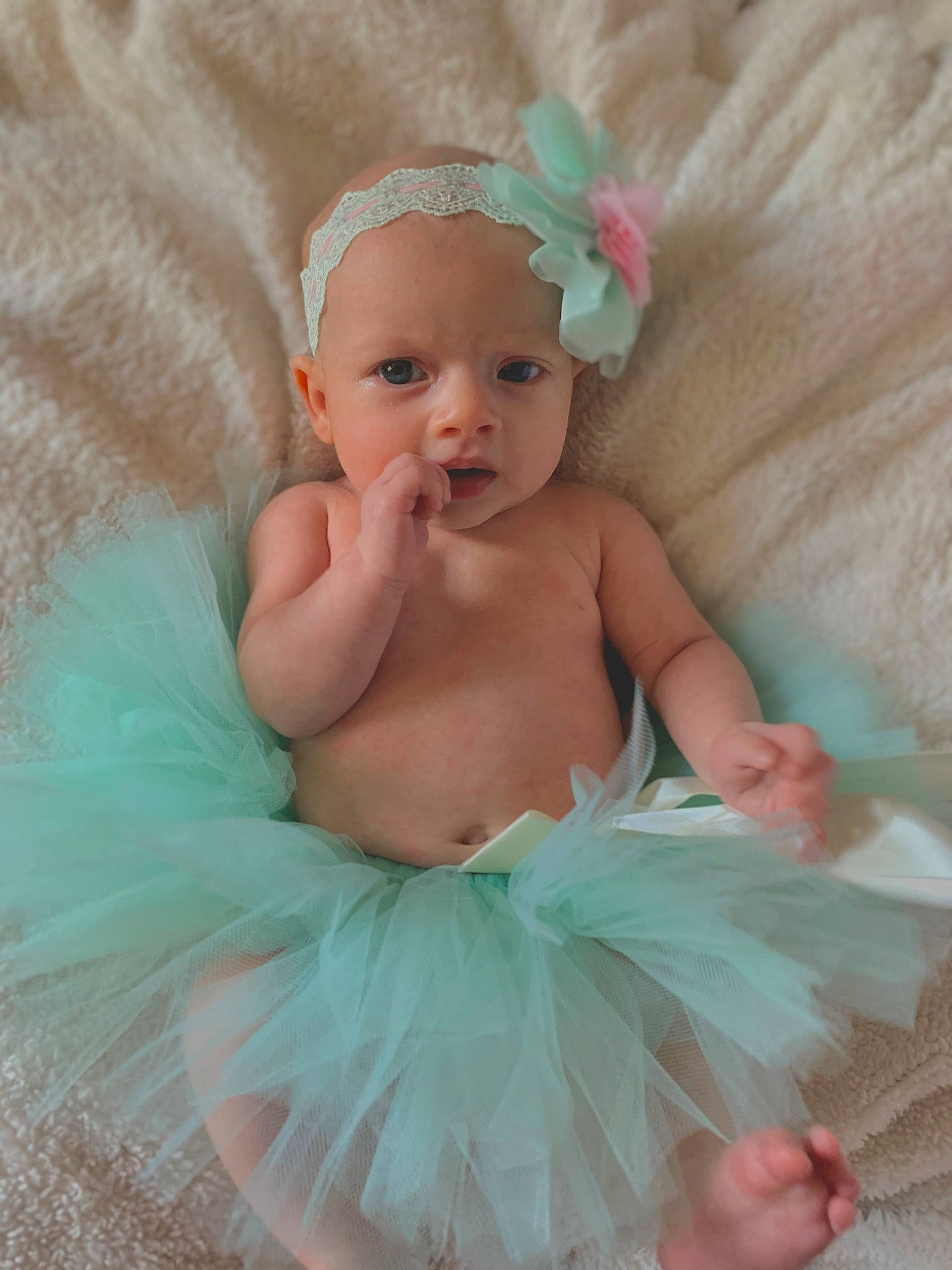 Madilyn is registered to the contest to win money with this photo: aqua, baby, baby_toddler_clothing, child, costume, costume_accessory, day_dress, embellishment, event, fashion_accessory, hair_accessory, happy, headband, headgear, headpiece, jewellery, peach, person, pink, toddler
