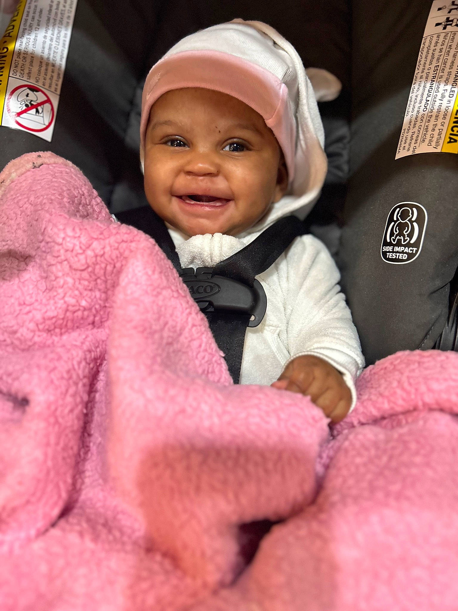 Nariyah is registered to the contest to win money with this photo: baby, baby_toddler_clothing, beanie, cap, cheek, child, comfort, fun, fur, happy, headwear, joy, laugh, linens, magenta, person, pink, polar_fleece, sleeve, smile