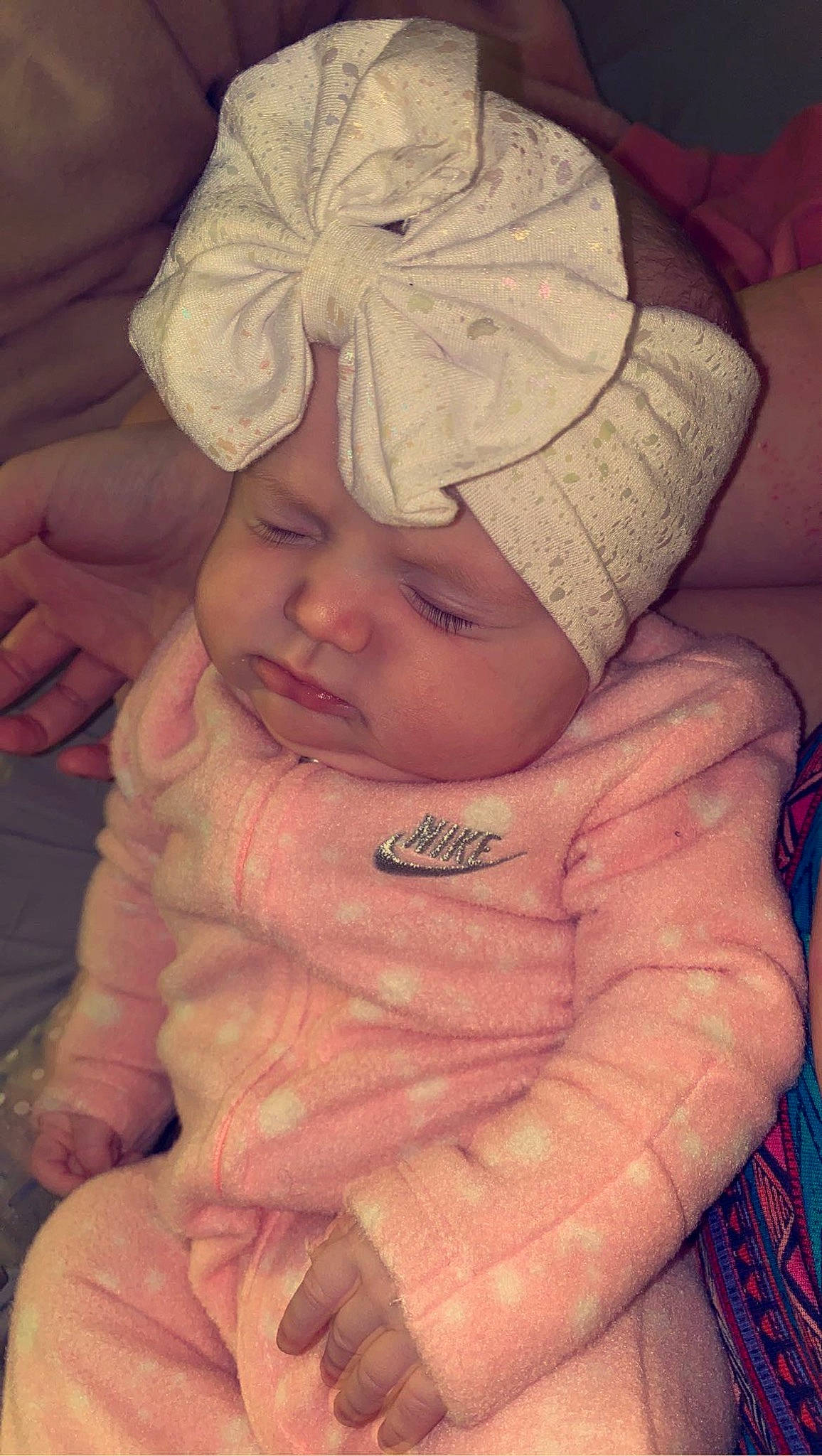 Kynleigh is registered to the contest to win money with this photo: baby, baby_toddler_clothing, cap, cheek, comfort, eye, finger, gesture, happy, headwear, human_body, iris, lip, mouth, nose, person, pink, skin, sleeve, smile