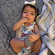 Annaliese joined the competition — help win amazing prizes! baby, child, infant, bow, headband, butterfly_print, sock, hand, foot, blanket, gray, cute, playful, clothing, sitting, indoors, soft_texture, portrait, happy, young