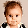 baby, child, portrait, face, smile, hair, wild_hair, eyes, cute, infant, expression, close_up, clothing, patterned_outfit, indoor, soft_background, head, skin, person, young_child