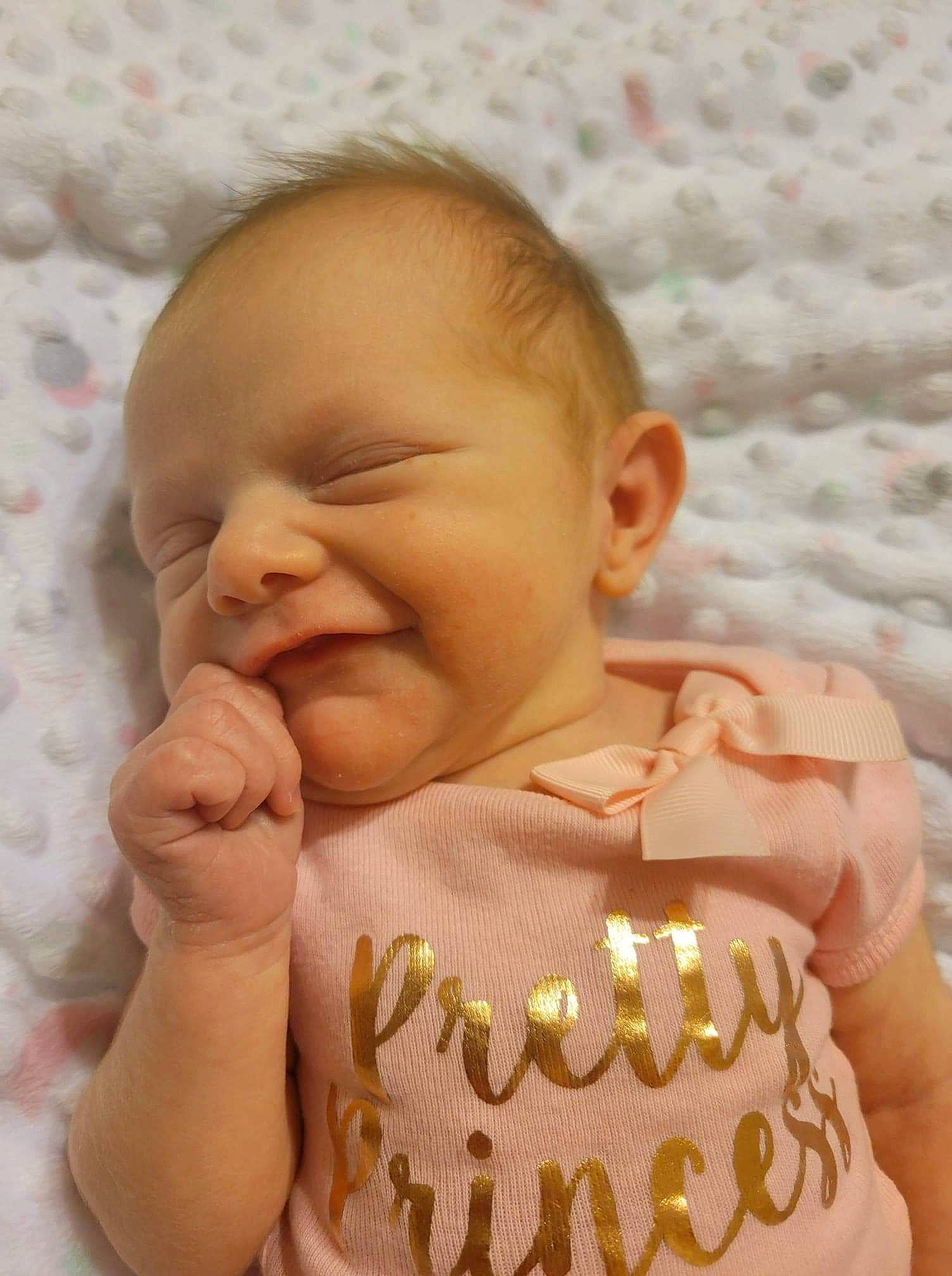 Ryleigh is registered to the contest to win money with this photo: baby, baby_toddler_clothing, cake, cake_decorating, cake_decorating_supply, candle, cheek, finger, food, gesture, happy, iris, lip, mouth, nose, person, skin, smile, sugar_cake, thumb
