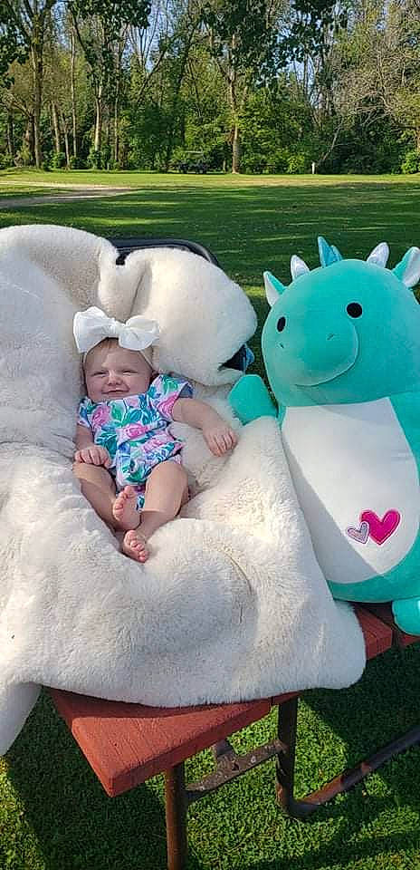 Ryleigh joined the competition — help win amazing prizes! baby, baby_toddler_clothing, botany, facial_expression, fun, grass, green, happy, headwear, interaction, leisure, mammal, person, pink, plant, product, public_space, recreation, skin, toddler