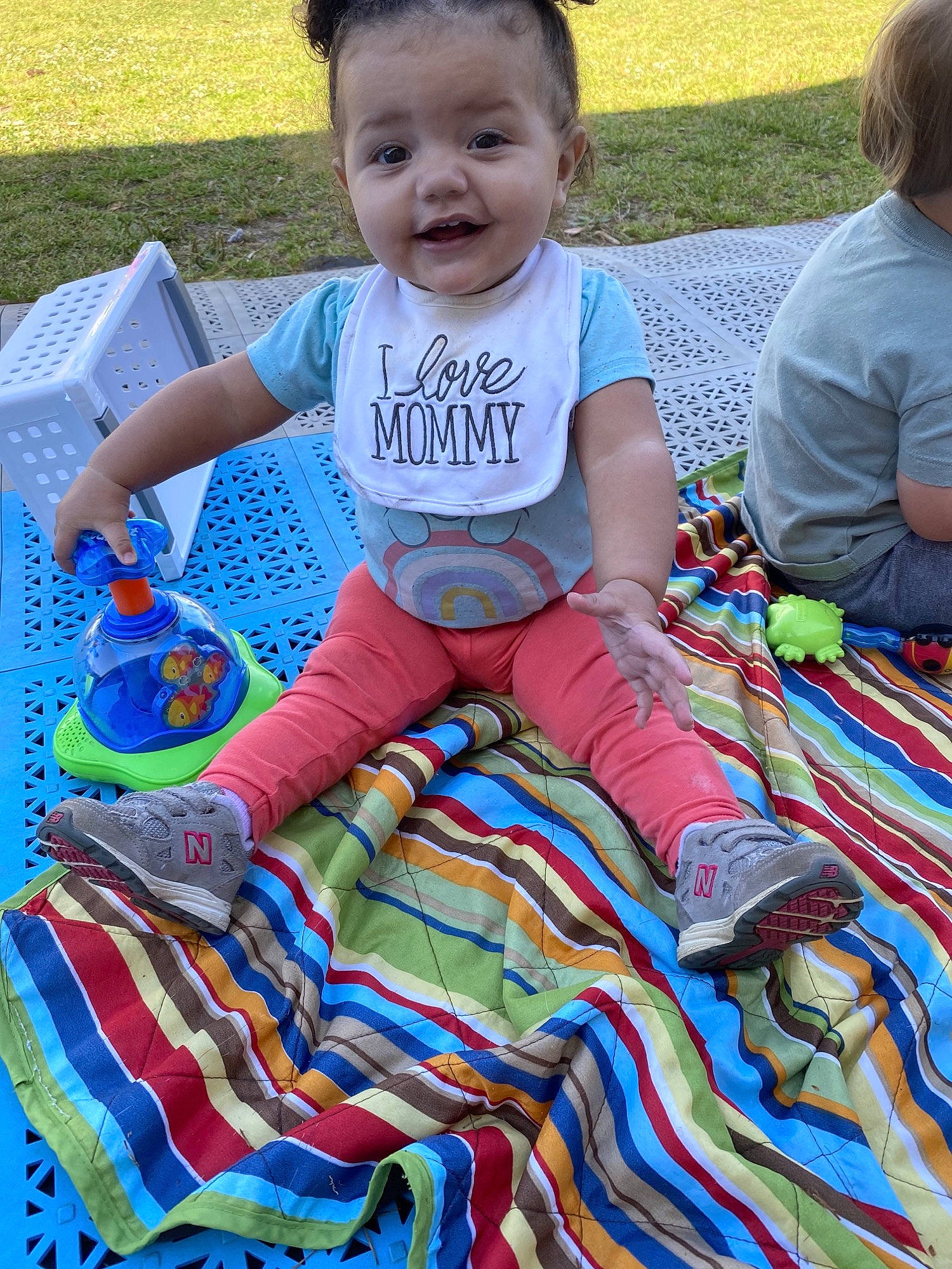 Jocelyn is registered to the contest to win money with this photo: baby, baby_products, baby_toddler_clothing, child, event, fun, grass, happy, head, leisure, linens, pattern, person, play, recreation, sitting, smile, t_shirt, thigh, toddler