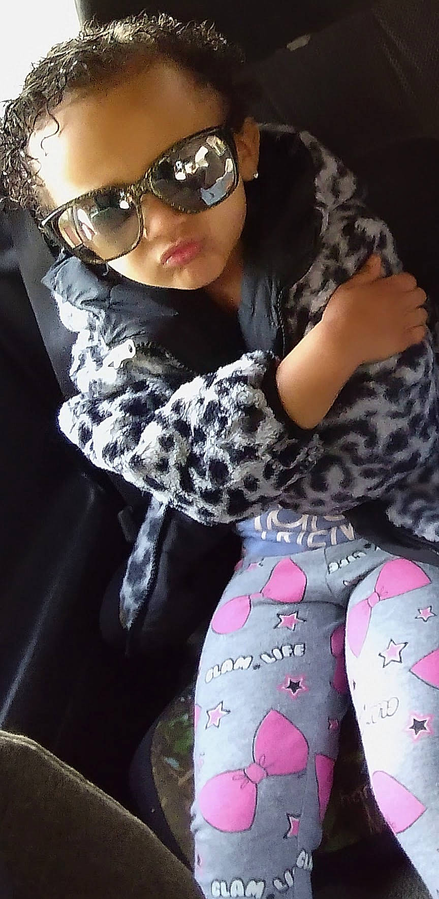 Skylar is registered to the contest to win money with this photo: arm, black, eyewear, fashion, glasses, goggles, hairstyle, headgear, human, lip, outerwear, person, photograph, pink, sleeve, street_fashion, sunglasses, thigh, vision_care, waist