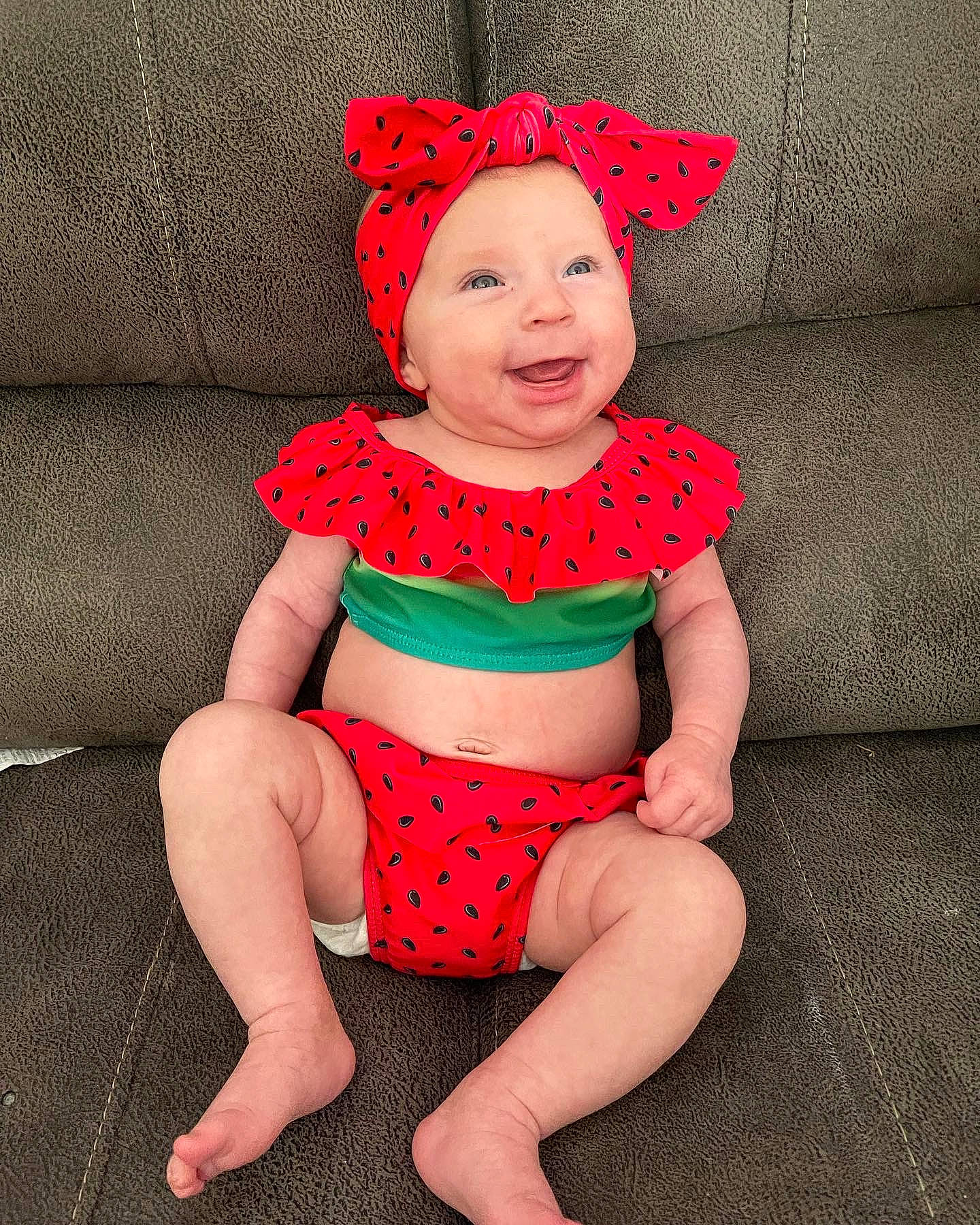 Rylee Mae Book is registered to the contest to win money with this photo: baby, baby_toddler_clothing, costume_hat, face, glasses, happy, head, headgear, headwear, human_body, knee, leg, person, pink, red, shorts, skin, sleeve, smile, thigh