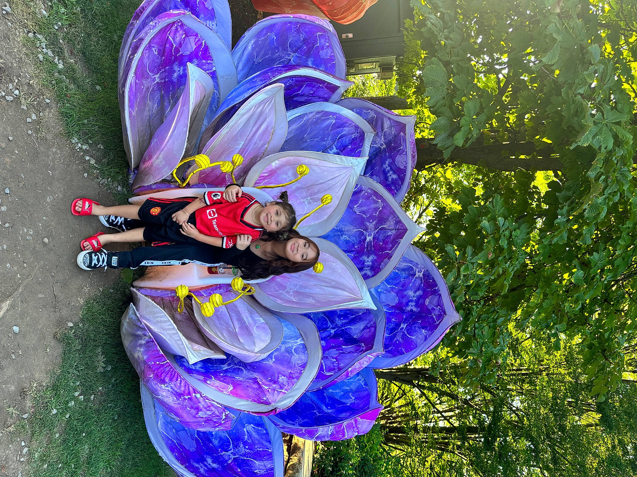 Harper Grace is registered to the contest to win money with this photo: art, automotive_wheel_system, electric_blue, fictional_character, flower, flowering_plant, grass, happy, illustration, joy, magenta, organism, painting, pattern, people_in_nature, person, petal, plant, purple, wildflower