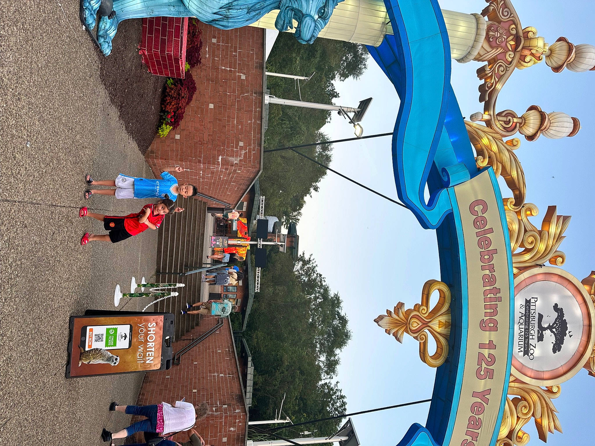 Harper Grace joined the competition — help win amazing prizes! art, blue, city, facade, fun, green, leisure, light, pedestrian, person, pole, sky, surprise, symbol, tree, urban_design, visual_arts, white, world