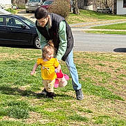 Octavia joined the competition — help win amazing prizes! child, toddler, adult, yellow_clothing, stuffed_animal, grass, outdoor, daylight, car, house, tree, person, playing, happy, walking, supporting, casual_clothing, young_adult, smile, suburban