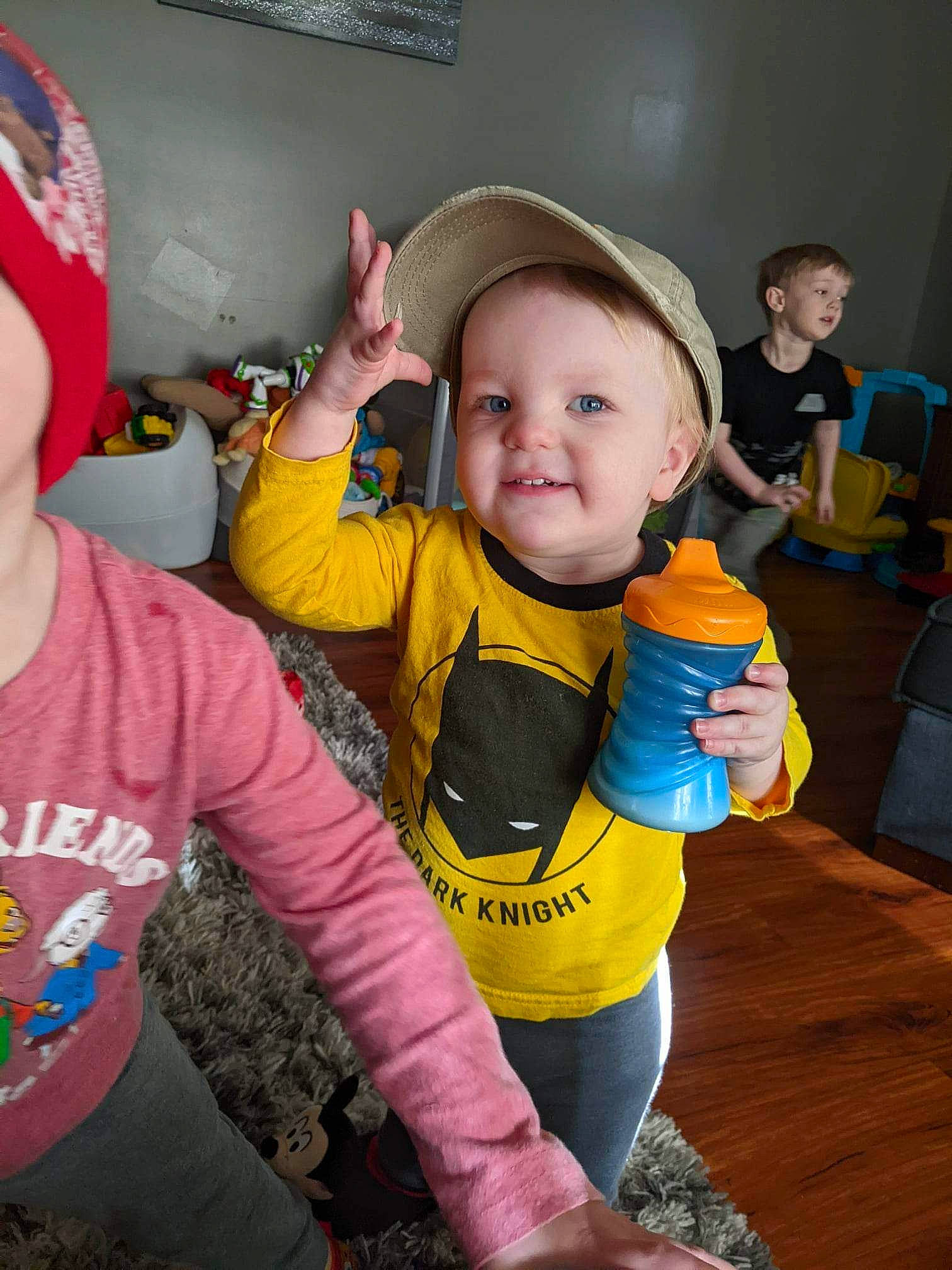 Kyler is registered to the contest to win money with this photo: baby, baseball_cap, cap, child, event, finger, fun, gesture, happy, hat, joy, organ, person, personal_protective_equipment, recreation, sleeve, smile, soil, t_shirt, thumb