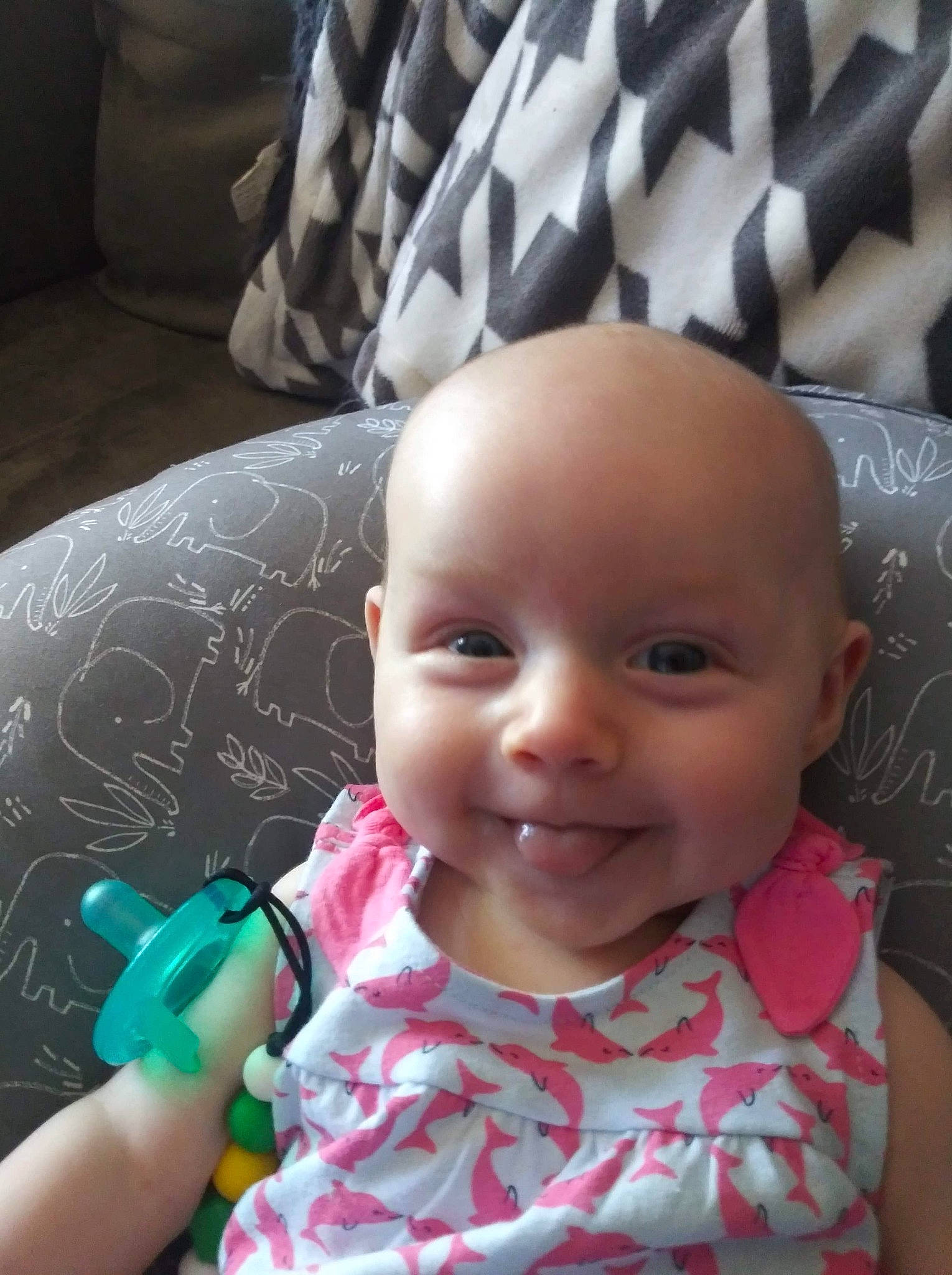 Adaline is registered to the contest to win money with this photo: baby, baby_toddler_clothing, black, cheek, comfort, eyelash, face, finger, hand, iris, joy, lip, mouth, nose, person, pink, product, skin, smile, textile