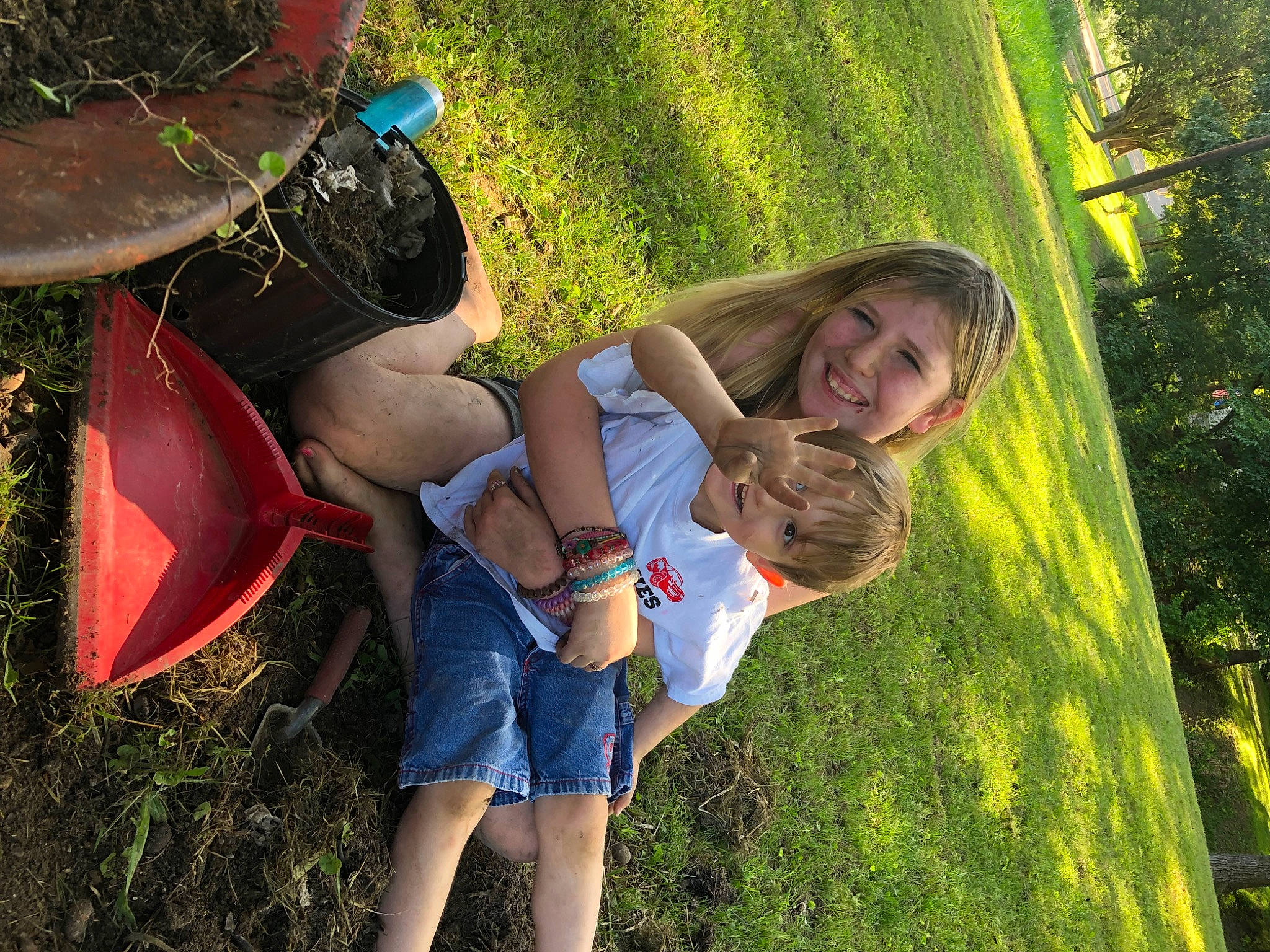 Abbygail is registered to the contest to win money with this photo: friendship, fun, gesture, grass, grass_family, grassland, green, happy, hat, joy, lawn, leg, leisure, meadow, natural_environment, people_in_nature, person, plant, recreation, shorts