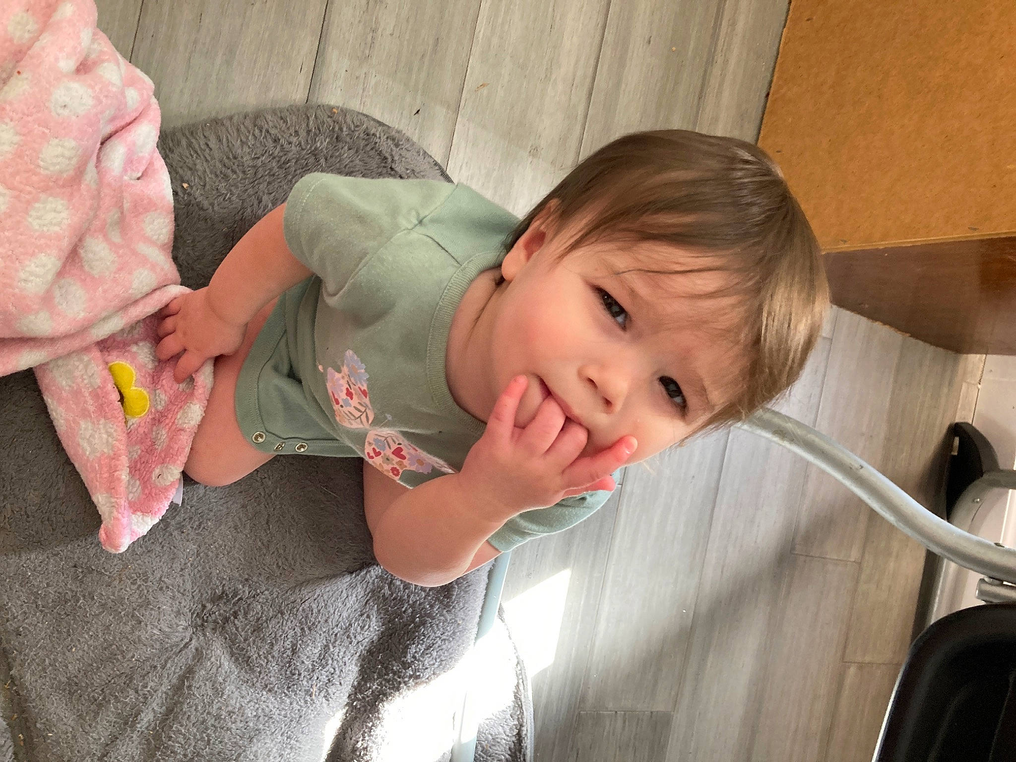 Alice is registered to the contest to win money with this photo: baby, baby_toddler_clothing, cheek, child, comfort, ear, finger, flooring, fun, gesture, hand, happy, leg, mouth, nose, person, plumbing_fixture, skin, thumb, toddler