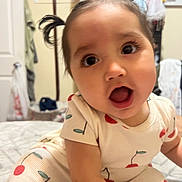 Elizabeth Hope joined the competition — help win amazing prizes! baby, child, face, pigtails, expression, indoor, clothing, pattern, cherry, cute, person, bed, room, furniture, curious, infant, portrait, young, skin, sitting