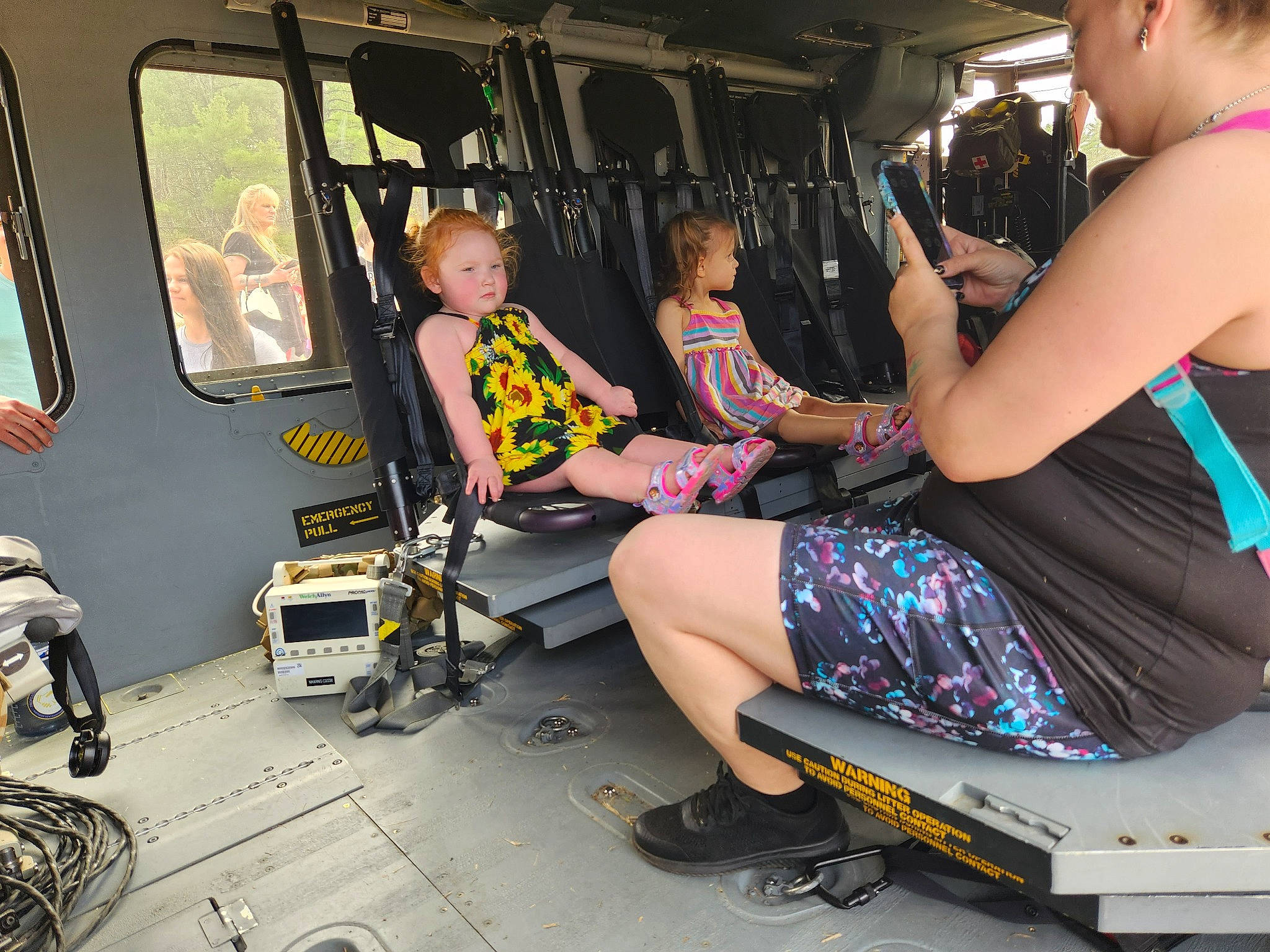 Alison joined the competition — help win amazing prizes! bag, event, foot, fun, human_leg, knee, lap, leg, leisure, luggage_and_bags, machine, motor_vehicle, passenger, pattern, person, public_transport, recreation, sandal, shorts, sitting