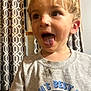 Karson joined the competition — help win amazing prizes! child, boy, tongue_out, tshirt, messy, scratched_nose, curtains, indoors, face, expression, playing, blond_hair, smile, young, person, casual_clothing, home, window, patterned_curtains, happy