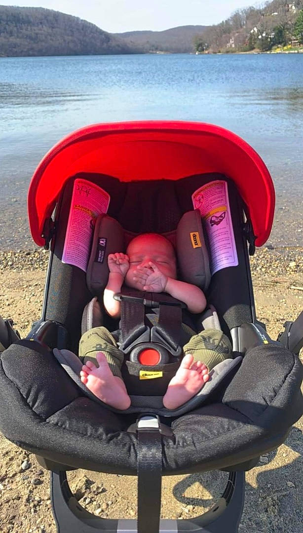 Atticus joined the competition — help win amazing prizes! automotive_design, automotive_exterior, baby_carriage, boats_and_boating_equipment_and_supplies, comfort, fun, grass, head, lake, leisure, motor_vehicle, outdoor_recreation, person, personal_protective_equipment, recreation, red, toddler, toy, travel, vehicle