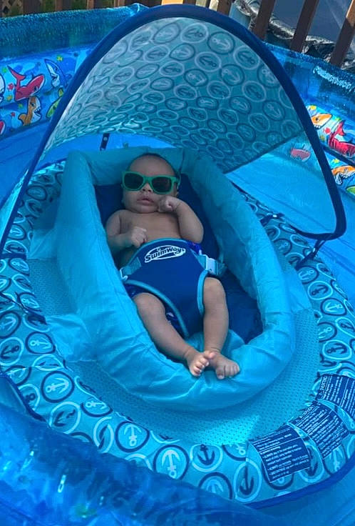 Atticus is registered to the contest to win money with this photo: aqua, azure, blue, circle, cool, electric_blue, eyewear, fun, glasses, goggles, happy, hat, leisure, magenta, person, recreation, shorts, smile, sunglasses, t_shirt