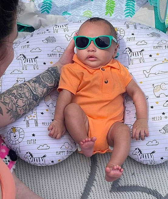Atticus joined the competition — help win amazing prizes! baby_toddler_clothing, child, cool, event, eyewear, fun, glasses, goggles, happy, human_leg, pattern, person, pink, sandal, sleeve, sunglasses, t_shirt, textile, thigh, toddler