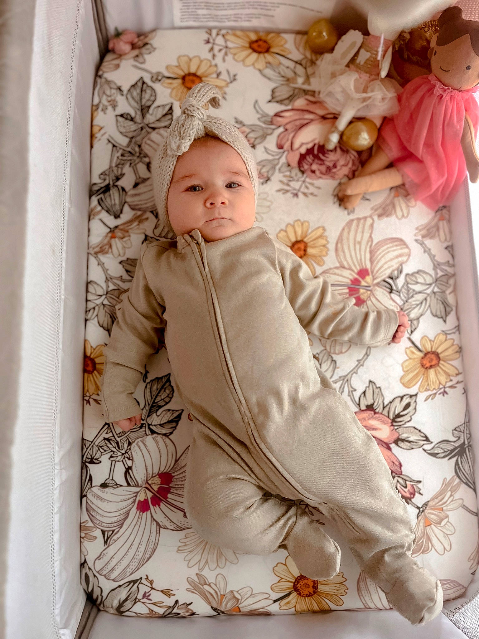Aya is registered to the contest to win money with this photo: baby, baby_products, baby_sleeping, baby_toddler_clothing, bedding, child, comfort, fur, headwear, linens, pattern, peach, person, pink, portrait_photography, room, sitting, sleeve, toddler, toy