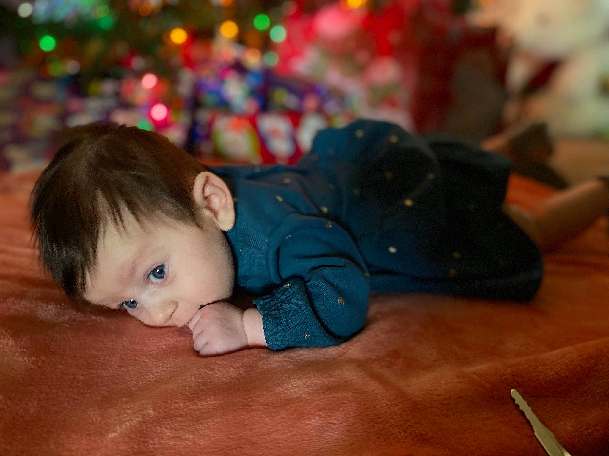 Athena is registered to the contest to win money with this photo: baby, baby_toddler_clothing, cheek, child, comfort, event, eye, flooring, fun, grass, happy, head, human_body, iris, person, plant, sitting, skin, toddler, tree