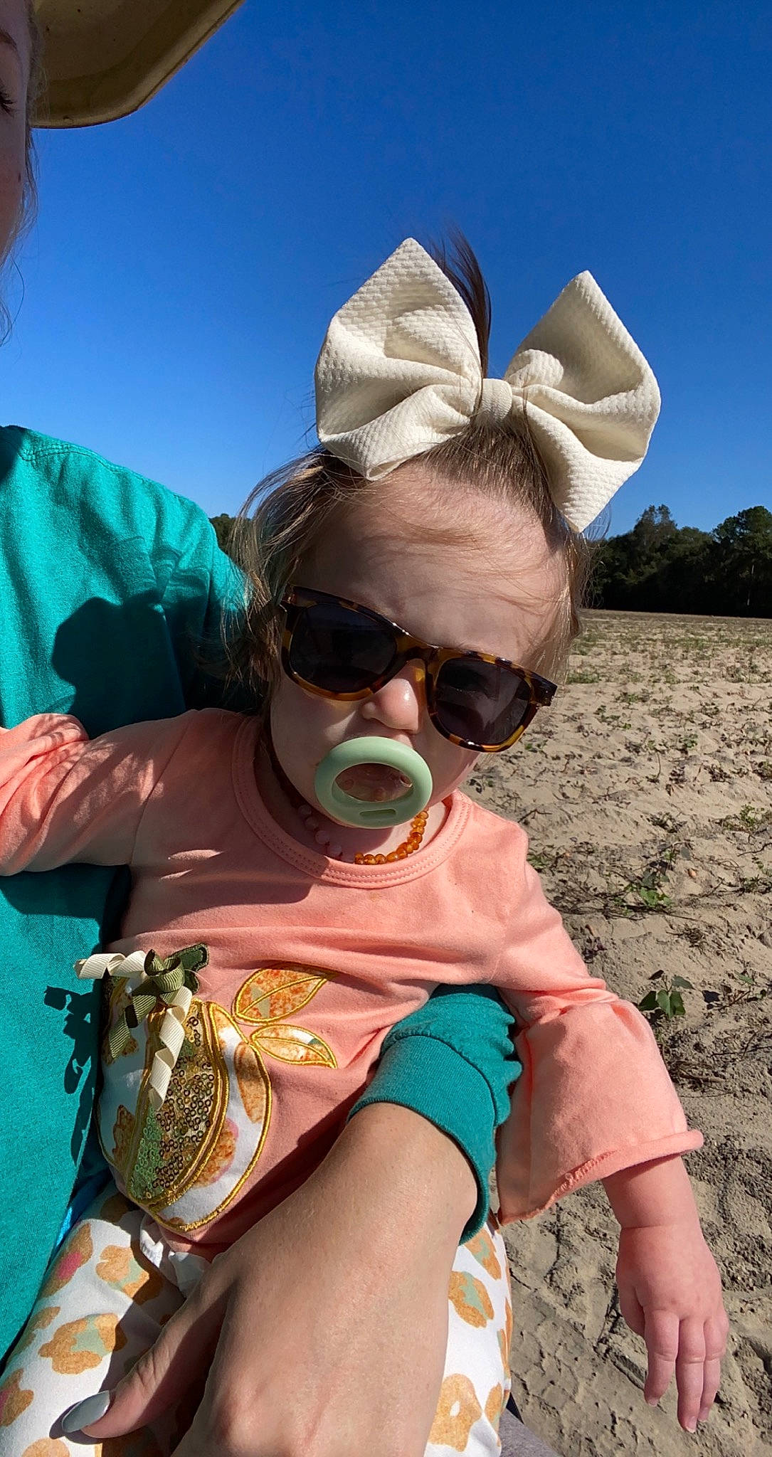 Emory is registered to the contest to win money with this photo: cool, eyewear, fedora, fun, glasses, goggles, grass, happy, hat, human_body, landscape, leisure, mammal, person, sky, sun_hat, sunglasses, toddler, travel, vertebrate