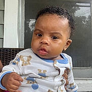 Rashim joined the competition — help win amazing prizes! baby, child, onesie, teddy_bear_pattern, curly_hair, porch, window, screen_door, hand, clothing, infant, cute, face, expression, outdoor, person, sitting, holding, skin, young