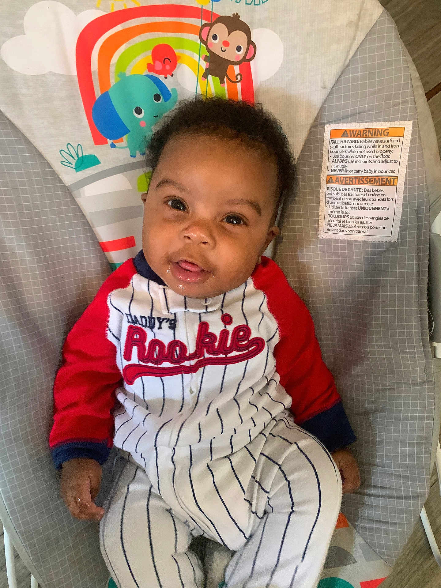 Rashim joined the competition — help win amazing prizes! baby, child, infant, bouncer, clothing, striped_outfit, red_sleeves, drool, face, eyes, cute, indoor, baby_toys, animal_print, monkey, elephant, octopus, seat, fabric, warning_label