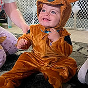 August Levi joined the competition — help win amazing prizes! child, toddler, reindeer_costume, costume, smiling, happy, portrait, indoor, christmas, christmas_tree, holiday, living_room, carpet, playpen, brick_wall, toy_car, brown, sitting, festive, family