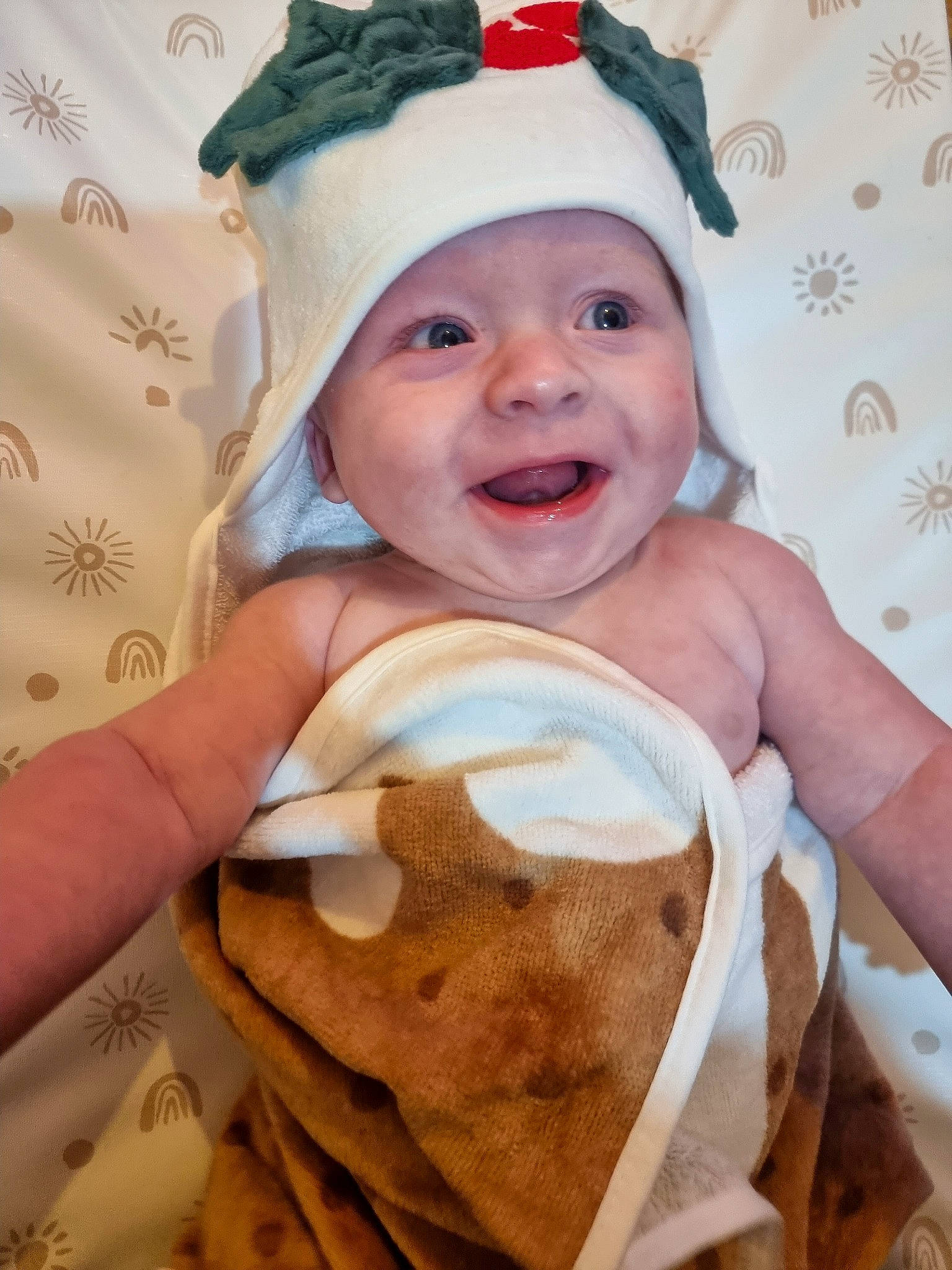 Bodi is registered to the contest to win money with this photo: baby, baby_laughing, baby_products, baby_toddler_clothing, cap, child, costume_hat, event, face, facial_expression, fashion_accessory, happy, headgear, headwear, linens, person, skin, sleeve, smile, textile