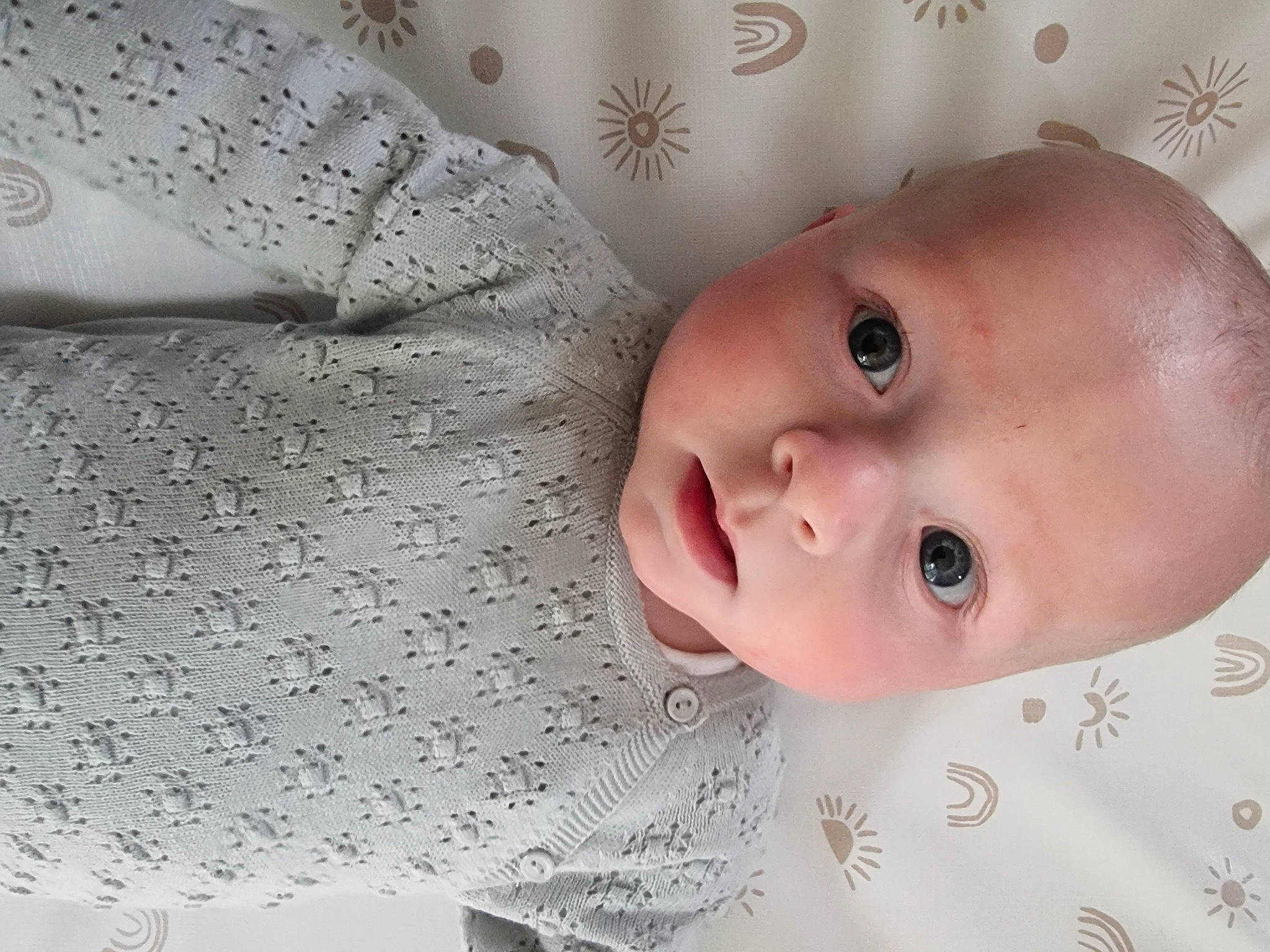 Bodi is registered to the contest to win money with this photo: baby, baby_toddler_clothing, cheek, child, dress, eye, eyebrow, eyelash, happy, iris, linens, lip, nose, pattern, person, product, skin, sleeve, smile, textile