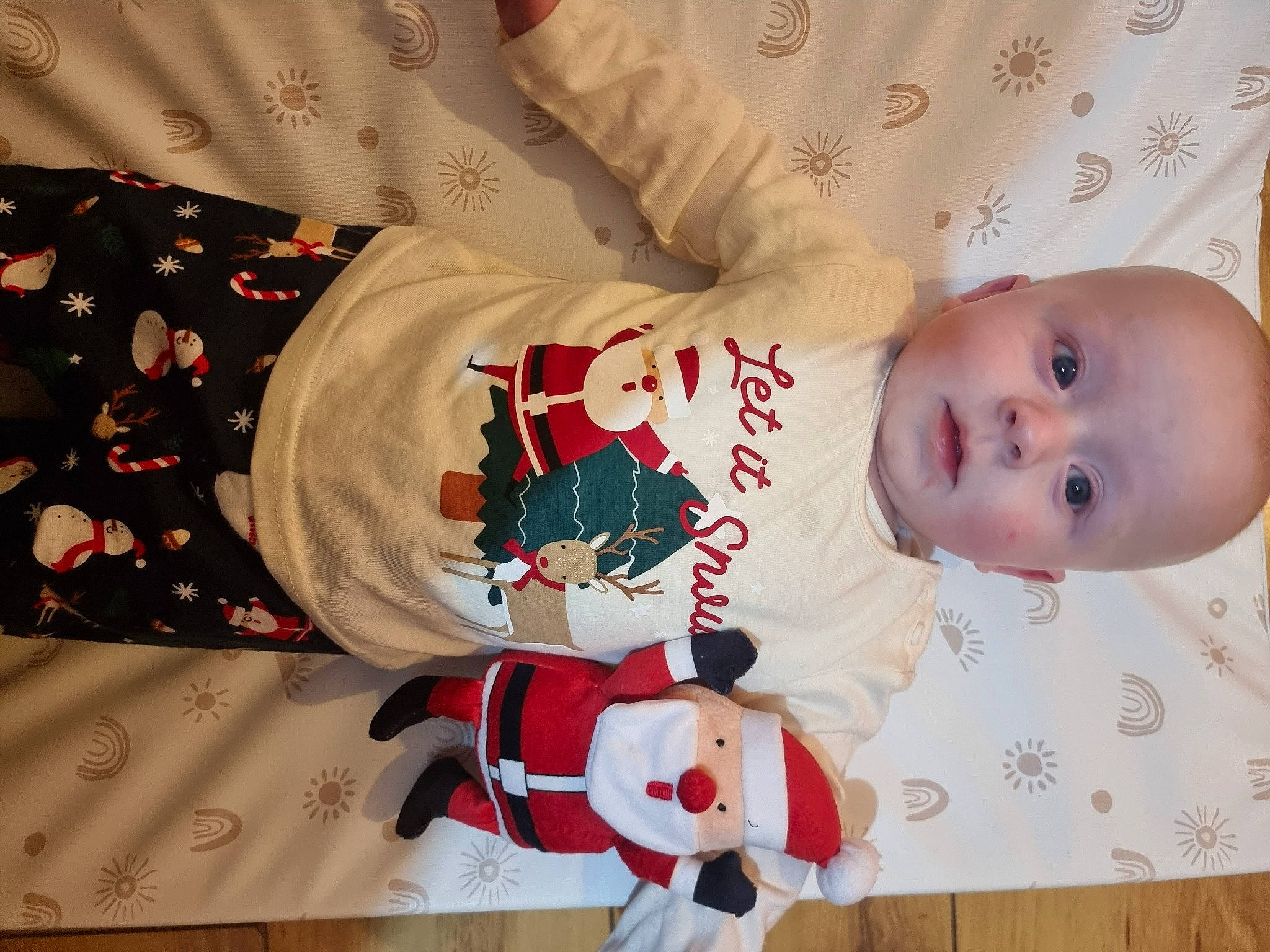 Bodi is registered to the contest to win money with this photo: baby, baby_products, baby_safety, baby_toddler_clothing, carmine, child, comfort, event, happy, head, holiday, human_body, lap, pattern, person, room, sleeve, sock, textile, toddler