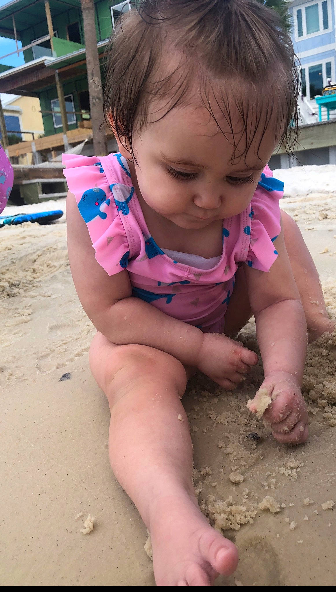 Amelia is registered to the contest to win money with this photo: beach, building_sand_castles, child, finger, foot, fun, hairstyle, human_leg, leg, leisure, mouth, person, pink, sand, sitting, skin, soil, summer, thigh, toddler