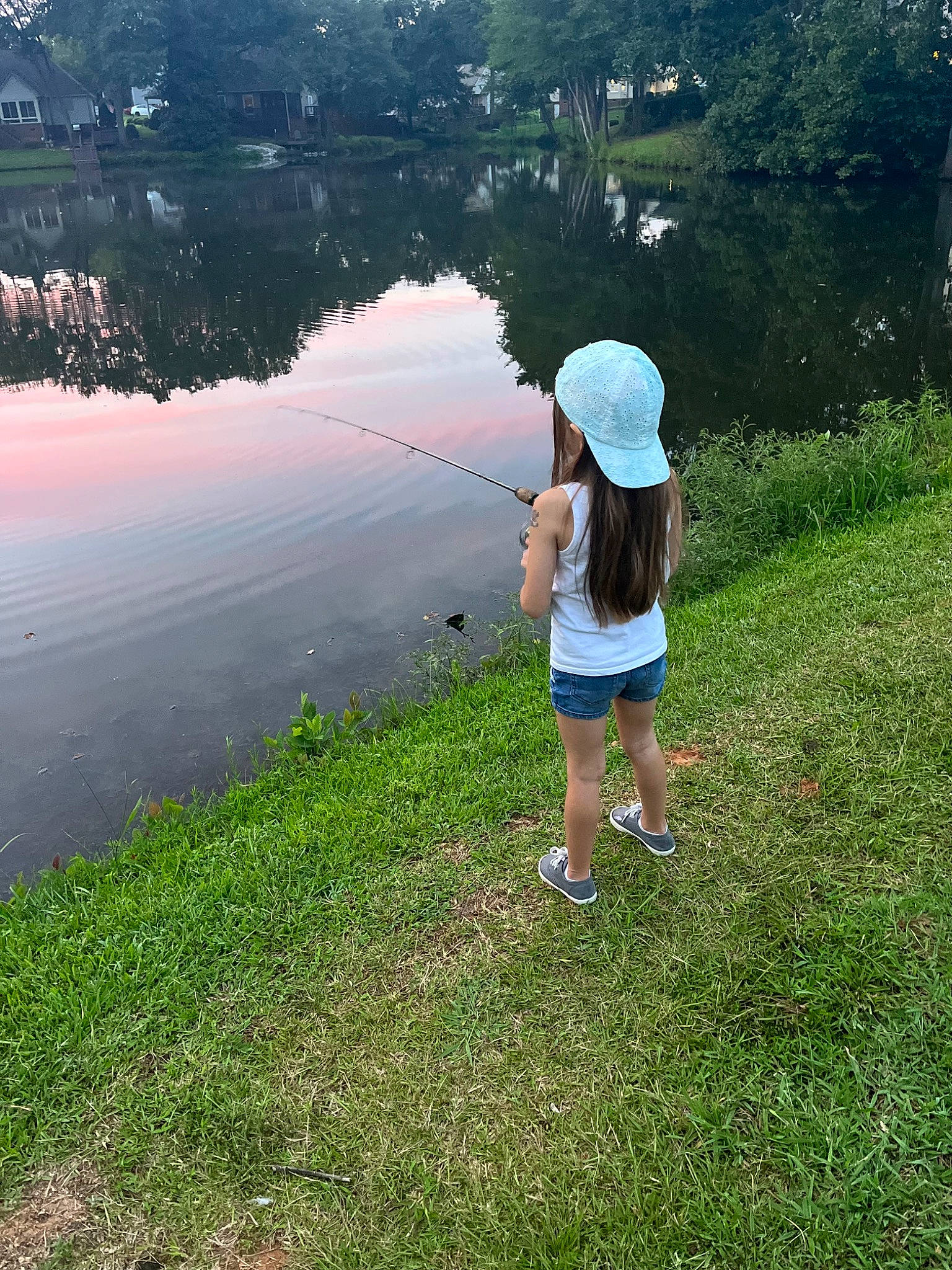 Skylar is registered to the contest to win money with this photo: grass, grass_family, grassland, happy, horizon, lake, landscape, leisure, meadow, natural_landscape, pasture, people_in_nature, person, plain, plant, recreation, reservoir, sky, toddler, tree