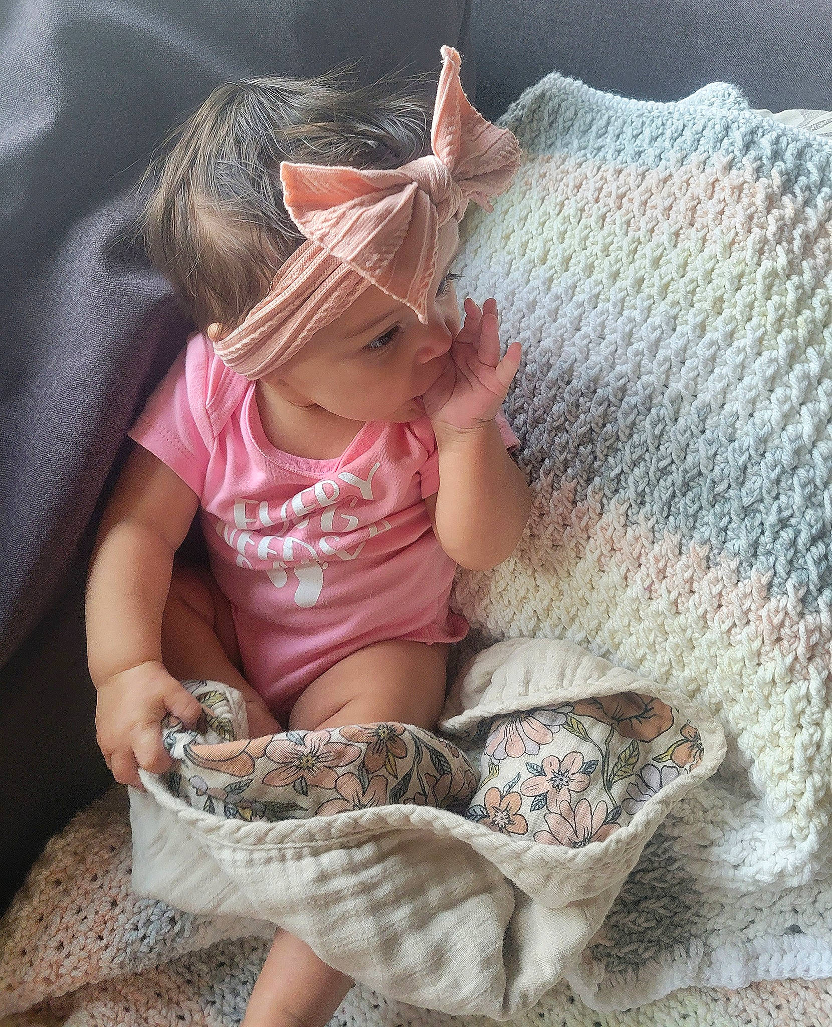 Kenya is registered to the contest to win money with this photo: baby_toddler_clothing, basket, child, comfort, dress, fashion_accessory, foot, fun, hat, human_leg, leg, linens, pattern, person, sitting, skin, sun_hat, textile, thigh, toddler