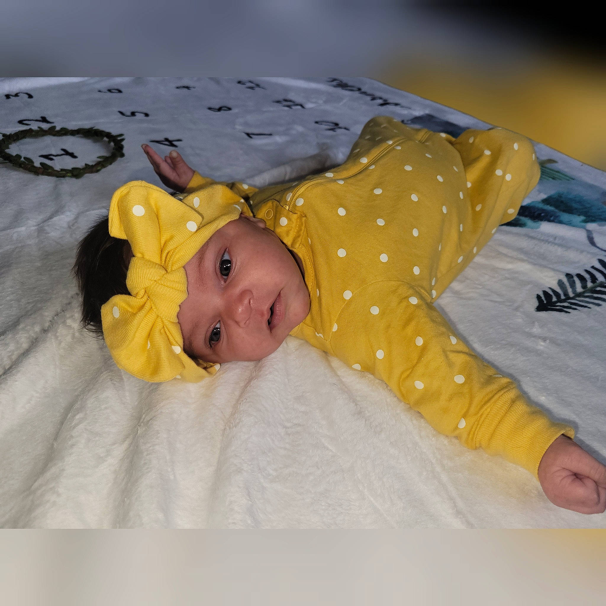 Kenya is registered to the contest to win money with this photo: baby, baby_toddler_clothing, bedding, child, comfort, happy, headwear, linens, pattern, person, room, sleeve, textile, toddler