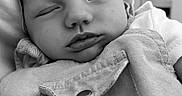 ïsaãc Demanne participe au concours pour gagner de l'argent avec cette photo : baby, black_and_white, button, calm, child, close_up, clothing, cute, fabric, face, head, indoors, infant, newborn, peaceful, portrait, resting, skin, sleeping, soft