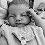 ïsaãc Demanne participe au concours pour gagner de l'argent avec cette photo : baby, sleeping, infant, close_up, hand, face, clothing, monochrome, black_and_white, peaceful, resting, portrait, newborn, soft, indoor, cute, child, person, toddler, young