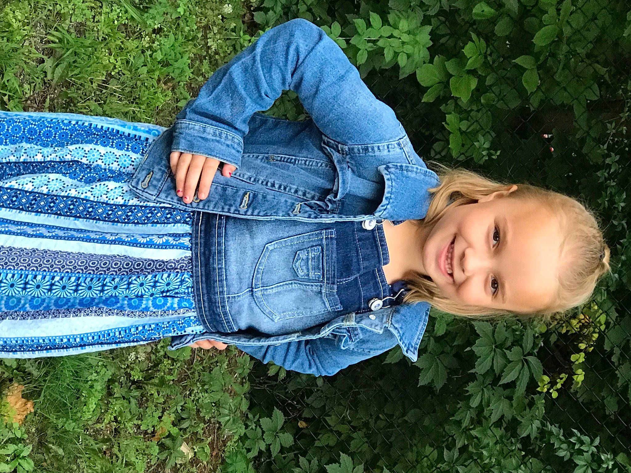 Harper is registered to the contest to win money with this photo: blue, child, denim, electric_blue, flash_photography, grass, grass_family, hand, happy, human_body, jeans, joy, leisure, pattern, people_in_nature, person, plant, sleeve, smile, standing
