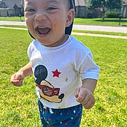 Uy-Thanh Louis is registered to the contest to win money with this photo: toddler, child, smiling, laughing, outdoor, grass, sunny, cap, tshirt, mickey_mouse, pants, stars, shoes, happy, cute, person, daylight, suburb, background, portrait