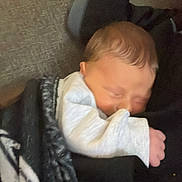Shawn is registered to the contest to win money with this photo: baby, newborn, sleeping, blanket, cozy, infant, soft, peaceful, child, closeup, cute, resting, indoors, warm, portrait, person, toddler, hands, clothing, hair