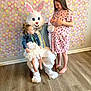 Scarlett joined the competition — help win amazing prizes! child, easter_bunny, costume, girl, pregnant, indoor, floor, dress, barefoot, smile, pattern, decoration, holiday, celebration, person, furniture, chair, pastel_colors, happy, curly_hair