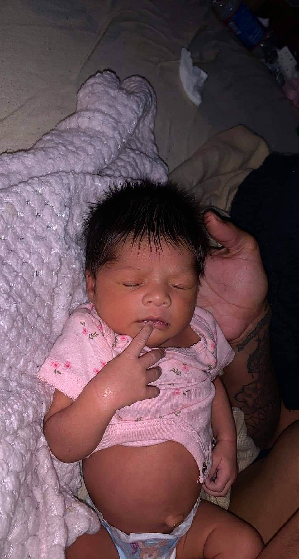 Khalia is registered to the contest to win money with this photo: baby, cheek, comfort, eye, eyebrow, face, facial_expression, finger, flash_photography, gesture, head, human_body, iris, lip, mouth, muscle, nose, person, pink, skin