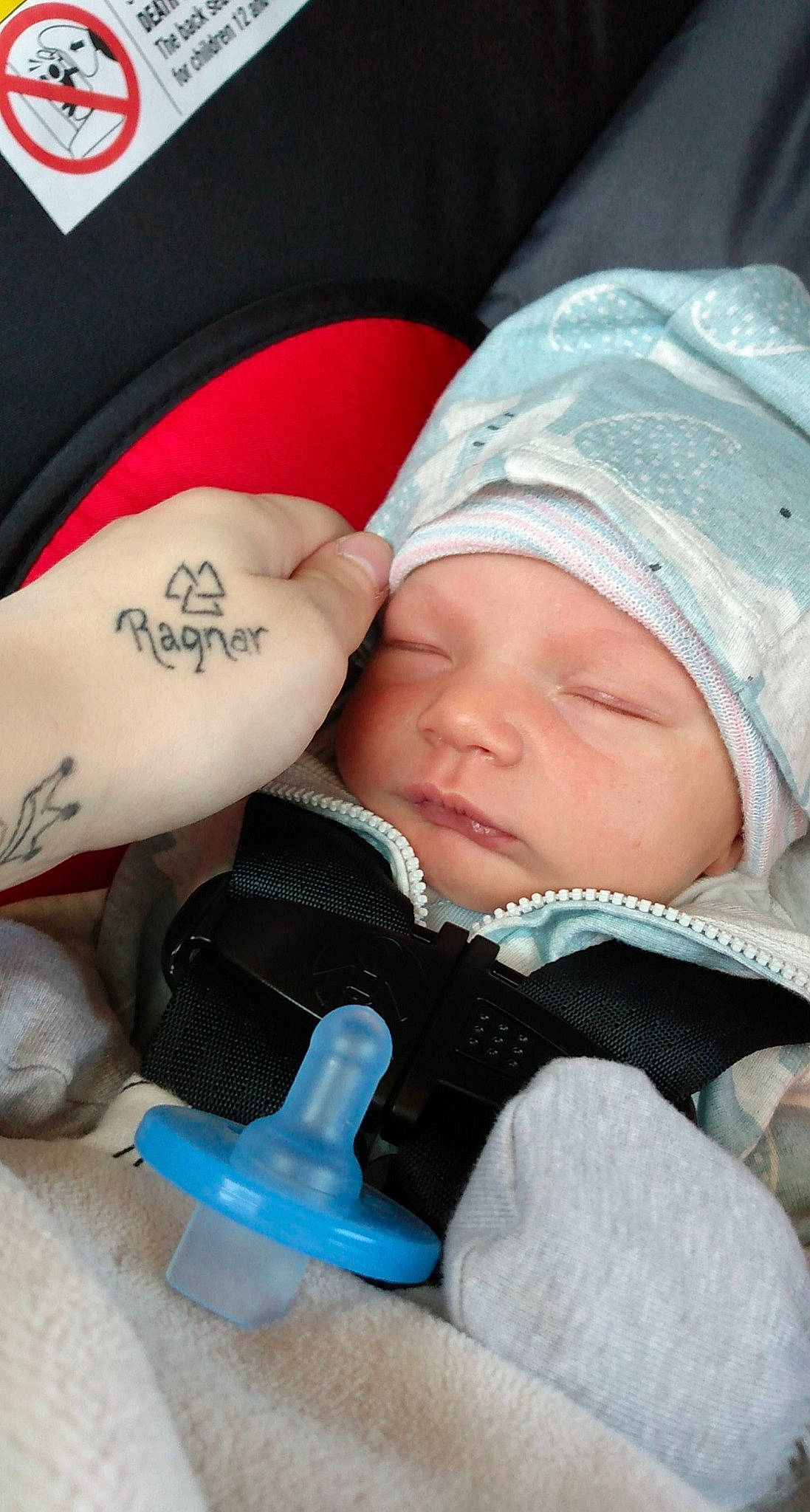 Ragnar Daniel-lane is registered to the contest to win money with this photo: arm, baby, baby_sleeping, baby_toddler_clothing, cap, cheek, child, comfort, eyelash, facial_expression, finger, hand, headgear, headwear, mammal, mouth, organ, person, product, skin